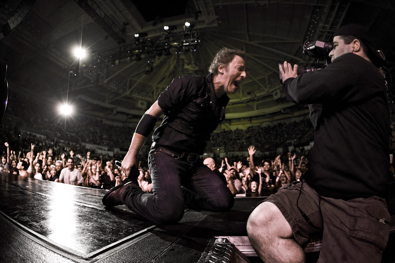 Bruce Springsteen slides on stage